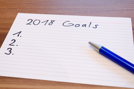 A piece of paper with the words "2018 Goals" written across the top