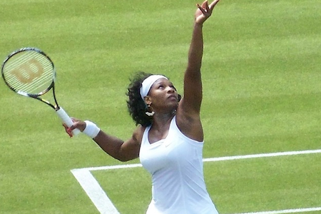 Serena Williams serving a tennis ball